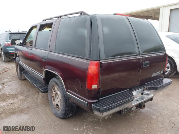 1997 Chevrolet Tahoe with VIN 1GNEK13R8VJ329165, listed as a IAAI auction lot 41631672 with 166,976 mi miles. Bid and sale history available at carsss.com. Image 3.