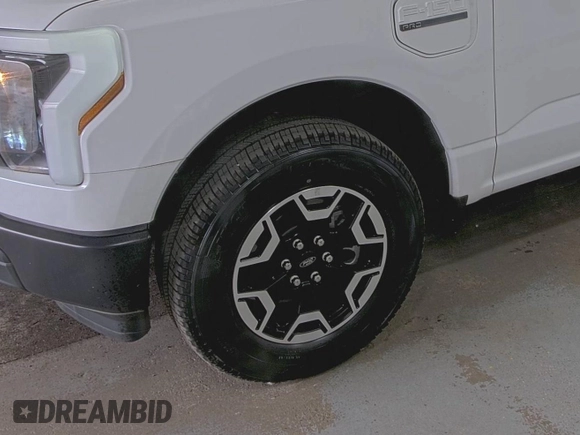 2022 Ford F-150 Lightning Pro with VIN 1FTVW1EL5NWG11725, listed as a IAAI auction lot 42832825 with 5,044 mi miles and . Bid and sale history available at DreamBid. Image 23.