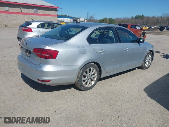 2015 Volkswagen Jetta Sedan 1.8T SE with VIN 3VWD17AJ0FM329783, listed as a IAAI auction lot 42142611 with 217,610 mi miles. Bid and sale history available at carsss.com. Image 4.