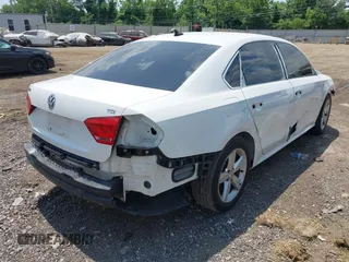 2015 Volkswagen Passat Wolfsburg Edition with VIN 1VWAT7A37FC112814, listed as a IAAI auction lot 42607166 with 123,429 mi miles and . Bid and sale history available at DreamBid. Image 4.