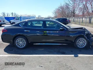 2015 Infiniti Q70 z VIN JN1BY1PR9FM831643, wystawiony jako IAAI lot #41886744 z przebiegiem 58 884 mil mil oraz . Historia ofert i sprzedaży dostępna na DreamBid. Obrazek 13.