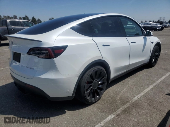2022 Tesla Model Y Performance with VIN 7SAYGDEFXNF407340, listed as a Copart auction lot 54376895 with 56,709 mi miles and Salvage Title. Bid and sale history available at DreamBid. Image 3.