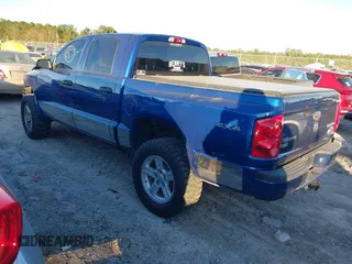 2010 Dodge Dakota Bighorn/Lonestar with VIN 1D7CW3GP5AS130870, listed as a IAAI auction lot 40929651 with 128,077 mi miles. Bid and sale history available at carsss.com. Image 3.