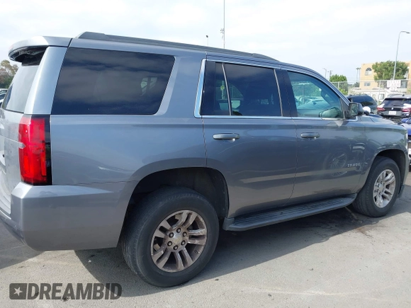 2018 Chevrolet Tahoe LS with VIN 1GNSCAEC2JR306131, listed as a IAAI auction lot 42338873 with 107,652 mi miles and . Bid and sale history available at DreamBid. Image 13.