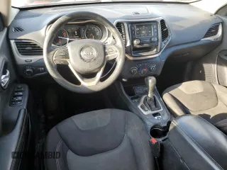 2016 Jeep Cherokee Sport with VIN 1C4PJLABXGW258322, listed as a Copart auction lot 51008975 with 128,865 mi miles and Salvage title. Bid and sale history available at DreamBid. Image 8.