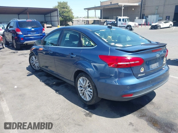 2018 Ford Focus Titanium with VIN 1FADP3J21JL323767, listed as a IAAI auction lot 42375218 with 104,440 mi miles and . Bid and sale history available at DreamBid. Image 3.