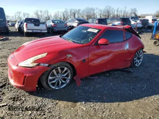 2014 Nissan 370Z Nismo with VIN JN1AZ4EH7EM630228, listed as a Copart auction lot 87024444 with 88,456 mi miles and Salvage Title. Bid and sale history available at DreamBid. Image 1.