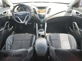 2013 Hyundai Veloster w/Black Int z VIN KMHTC6AD2DU125066, wystawiony jako Copart lot #60921325 z przebiegiem 189 503 mil mil oraz Czysty tytuł • Clean title. Historia ofert i sprzedaży dostępna na DreamBid. Obrazek 8.