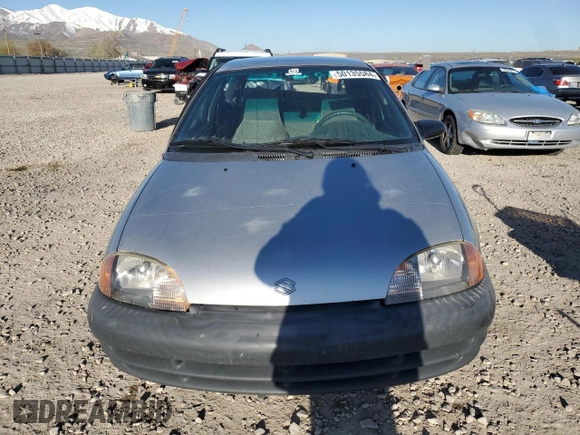 2001 Suzuki Swift GA z VIN 2S2AB21H516602339, wystawiony jako Copart lot #50135584 z przebiegiem 142 476 mil mil oraz Szkody całkowita. Historia ofert i sprzedaży dostępna na DreamBid. Obrazek 5.