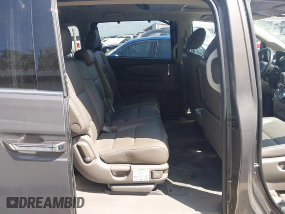 2014 Honda Odyssey Touring with VIN 5FNRL5H99EB075979, listed as a IAAI auction lot 42520154 with 99,314 mi miles and . Bid and sale history available at DreamBid. Image 8.