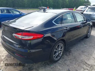 2019 Ford Fusion Titanium z VIN 3FA6P0RU7KR194482, wystawiony jako IAAI lot #42176110 z przebiegiem 80 771 mil mil oraz . Historia ofert i sprzedaży dostępna na DreamBid. Obrazek 4.