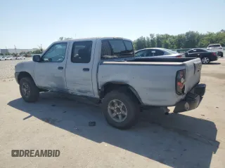 2003 Nissan Frontier XE with VIN 1N6ED27T23C456197, listed as a Copart auction lot 57393515 with 181,596 mi miles and Salvage title. Bid and sale history available at DreamBid. Image 2.
