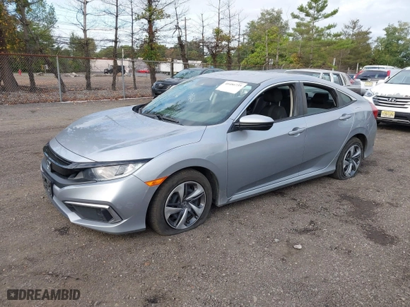 2019 Honda Civic Sedan LX with VIN 2HGFC2F65KH586106, listed as a IAAI auction lot 40486735 with 82,714 mi miles. Bid and sale history available at carsss.com. Image 2.