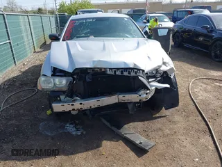 2013 Dodge Charger Police z VIN 2C3CDXAT9DH549866, wystawiony jako IAAI lot #42063862 z przebiegiem 145 191 mil mil oraz . Historia ofert i sprzedaży dostępna na DreamBid. Obrazek 6.
