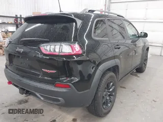 2019 Jeep Cherokee Trailhawk with VIN 1C4PJMBX9KD456748, listed as a IAAI auction lot 42367186 with 91,665 mi miles and . Bid and sale history available at DreamBid. Image 4.