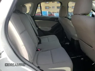2014 Mazda CX-5 Sport with VIN JM3KE2BE9E0344990, listed as a Copart auction lot 59014145 with 126,905 mi miles and Salvage title. Bid and sale history available at DreamBid. Image 10.