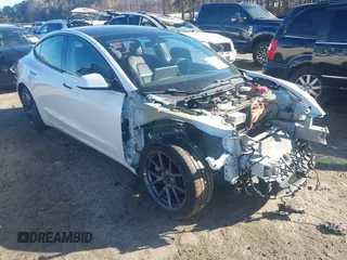 2021 Tesla Model 3 Long Range with VIN 5YJ3E1EB1MF062593, listed as a IAAI auction lot 41667484 with 33,445 mi miles and . Bid and sale history available at carsss.com. Image 1.