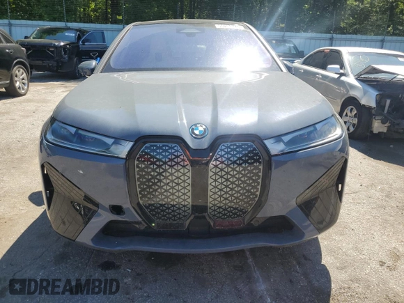 2022 BMW iX xDrive50 с VIN WB523CF00NCK44547, выставлен на аукционе Copart как лот 55262775 с пробегом 22 664 миль миль и Списание • Salvage title. История ставок и продаж доступна на DreamBid. Изображение 5.