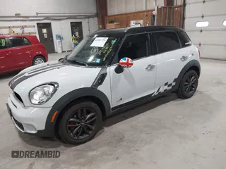 2012 MINI Countryman S with VIN WMWZC5C58CWL60067, listed as a IAAI auction lot 42081725 with 104,397 mi miles and . Bid and sale history available at DreamBid. Image 2.