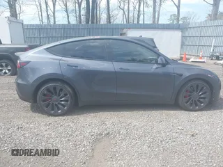 2022 Tesla Model Y Performance with VIN 7SAYGDEF3NF324705, listed as a IAAI auction lot 42076565 with 66,573 mi miles and . Bid and sale history available at carsss.com. Image 13.