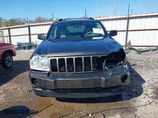 2006 Jeep Grand Cherokee Laredo with VIN 1J4GR48K56C326847, listed as a IAAI auction lot 41972623 with 141,088 mi miles. Bid and sale history available at carsss.com. Image 13.