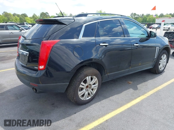 2014 Cadillac SRX with VIN 3GYFNAE30ES641616, listed as a IAAI auction lot 42000120 with 145,000 mi miles and . Bid and sale history available at DreamBid. Image 4.