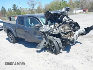 2014 Toyota Tacoma PreRunner with VIN 5TFJU4GN7EX051446, listed as a IAAI auction lot 41881560 with 232,280 mi miles and . Bid and sale history available at DreamBid. Image 1.