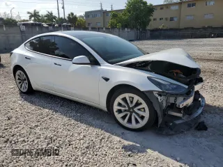 2023 Tesla Model 3 with VIN 5YJ3E1EA6PF510323, listed as a Copart auction lot 52094495 with 115,928 mi miles and Salvage Title. Bid and sale history available at DreamBid. Image 4.