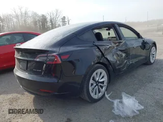 2022 Tesla Model 3 Long Range with VIN 5YJ3E1EB6NF343869, listed as a IAAI auction lot 41826077 with 36,643 mi miles and . Bid and sale history available at DreamBid. Image 4.