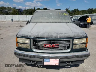 1998 GMC Suburban z VIN 3GKFK16R1WG511256, wystawiony jako Copart lot #77568484 z przebiegiem 301 116 mil mil oraz Czysty tytuł • Clean title. Historia ofert i sprzedaży dostępna na DreamBid. Obrazek 5.