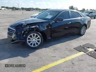 2015 Cadillac CTS RWD with VIN 1G6AP5SX8F0140364, listed as a IAAI auction lot 42535236 with 126,277 mi miles and . Bid and sale history available at DreamBid. Image 2.