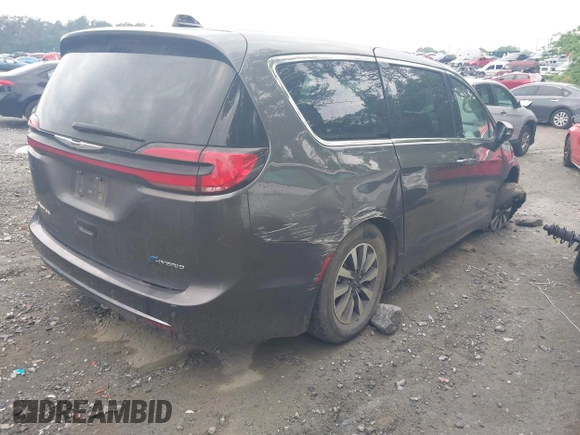 2023 Chrysler Pacifica Hybrid Touring L with VIN 2C4RC1L72PR540902, listed as a IAAI auction lot 42151047 with Not Provided miles and . Bid and sale history available at DreamBid. Image 4.