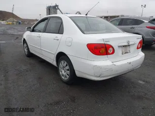 2004 Toyota Corolla CE with VIN 1NXBR32E34Z335238, listed as a IAAI auction lot 41987476 with 124,999 mi miles. Bid and sale history available at carsss.com. Image 3.