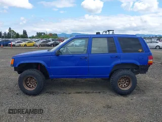 1996 Jeep Grand Cherokee Laredo with VIN 1J4GZ58YXTC329037, listed as a IAAI auction lot 42051175 with 314,571 mi miles and . Bid and sale history available at DreamBid. Image 14.