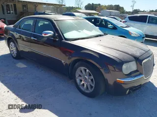 2005 Chrysler 300 with VIN 2C3AA63H75H577363, listed as a IAAI auction lot 41892999 with 229,634 mi miles. Bid and sale history available at carsss.com. Image 1.