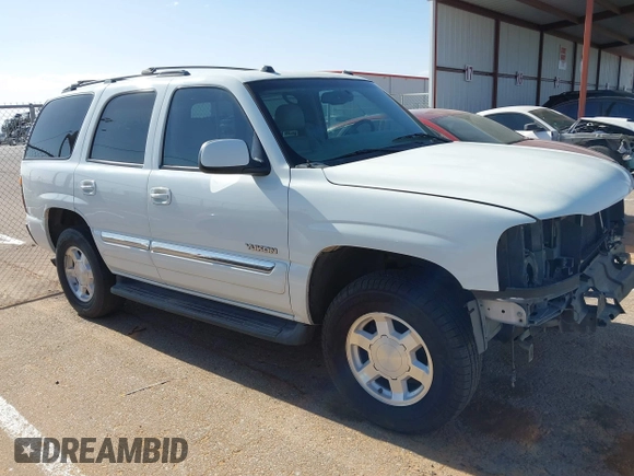 2005 GMC Yukon SLT z VIN 1GKEC13TX5R276234, wystawiony jako IAAI lot #42127846 z przebiegiem 210 802 mil mil oraz . Historia ofert i sprzedaży dostępna na DreamBid. Obrazek 14.