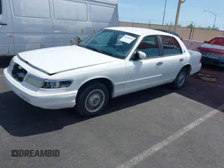 1996 Mercury Grand Marquis GS with VIN 2MELM74WXTX650841, listed as a IAAI auction lot 41936608 with 205,964 mi miles and . Bid and sale history available at DreamBid. Image 2.