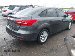 2015 Ford Focus SE with VIN 1FADP3F28FL219552, listed as a IAAI auction lot 41959648 with 128,590 mi miles. Bid and sale history available at carsss.com. Image 4.