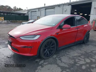 2022 Tesla Model X Plaid with VIN 7SAXCBE60NF330246, listed as a IAAI auction lot 41477394 with 51,612 mi miles and . Bid and sale history available at carsss.com. Image 2.