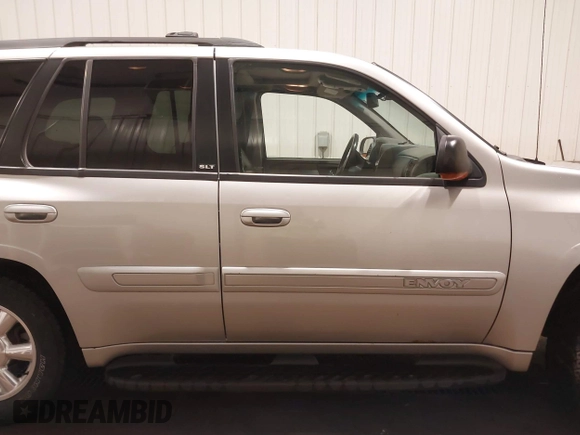 2004 GMC Envoy SLE with VIN 1GKDT13S042243883, listed as a IAAI auction lot 41795335 with 162,873 mi miles. Bid and sale history available at carsss.com. Image 13.