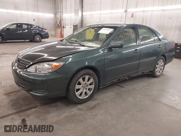 2004 Toyota Camry LE with VIN 4T1BE32K04U361670, listed as a IAAI auction lot 42139994 with 205,899 mi miles. Bid and sale history available at carsss.com. Image 2.
