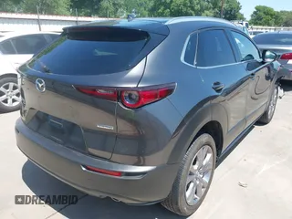 2022 Mazda CX-30 S Premium with VIN 3MVDMBDL5NM416649, listed as a IAAI auction lot 41990745 with 13,923 mi miles and . Bid and sale history available at DreamBid. Image 4.