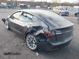 2021 Tesla Model 3 Long Range with VIN 5YJ3E1EB6MF975916, listed as a IAAI auction lot 40713749 with 29,593 mi miles and . Bid and sale history available at DreamBid. Image 3.