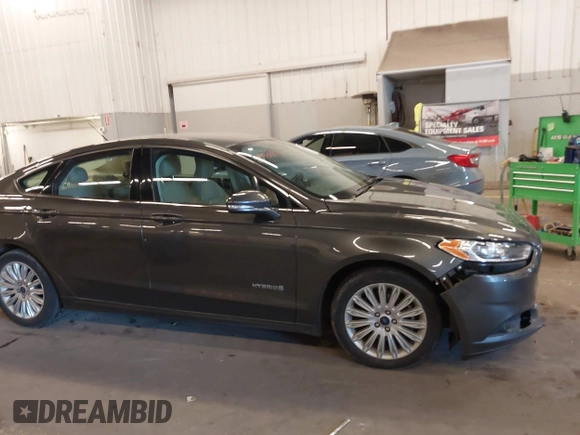 2016 Ford Fusion SE Hybrid with VIN 3FA6P0LU9GR235291, listed as a IAAI auction lot 41560312 with 112,777 mi miles. Bid and sale history available at carsss.com. Image 12.