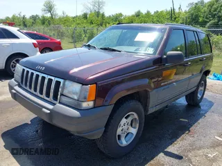 1997 Jeep Grand Cherokee TSi with VIN 1J4FX58S2VC747897, listed as a IAAI auction lot 42033868 with 119,924 mi miles. Bid and sale history available at carsss.com. Image 2.
