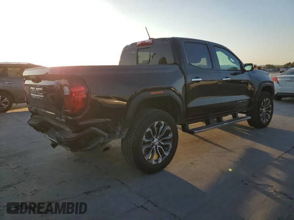 2023 GMC Canyon 4WD Denali with VIN 1GTP6FEK8P1164692, listed as a Copart auction lot 77033234 with 5,644 mi miles and Salvage Title. Bid and sale history available at carsss.com. Image 3.