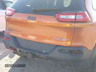 2014 Jeep Cherokee Trailhawk with VIN 1C4PJMBS4EW254879, listed as a IAAI auction lot 41550356 with 101,077 mi miles. Bid and sale history available at carsss.com. Image 21.