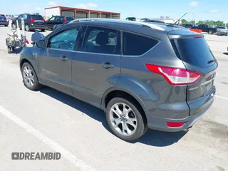 2015 Ford Escape Titanium z VIN 1FMCU9J92FUB01007, wystawiony jako IAAI lot #42319246 z przebiegiem 90 782 mil mil oraz . Historia ofert i sprzedaży dostępna na DreamBid. Obrazek 3.