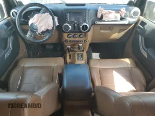 2012 Jeep Wrangler Unlimited Sahara with VIN 1C4HJWEG5CL205826, listed as a Copart auction lot 58222115 with 98,940 mi miles and Salvage title. Bid and sale history available at DreamBid. Image 8.