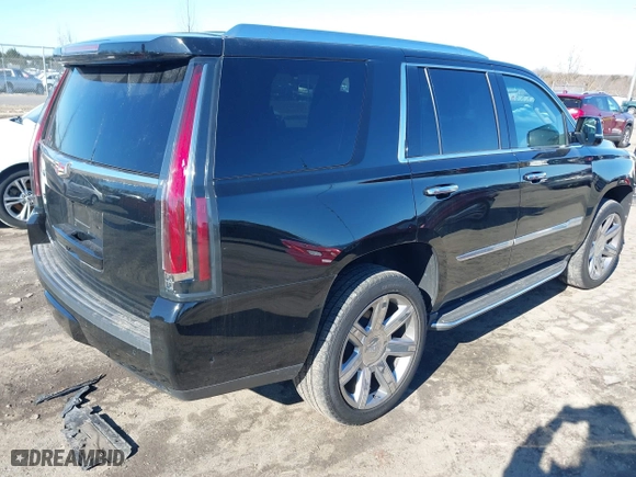 2019 Cadillac Escalade Premium Luxury with VIN 1GYS4CKJ0KR125240, listed as a IAAI auction lot 41568885 with 60,000 mi miles. Bid and sale history available at carsss.com. Image 4.